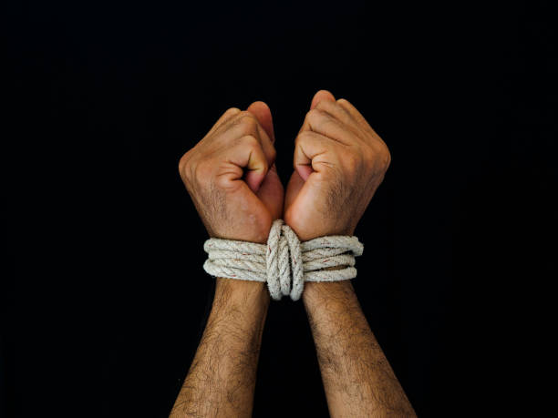istock Man hands were tied with a rope. Violence, Terrified, Human Rights Day concept. 968306216