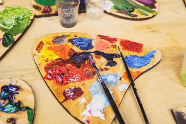 istock Artistic equipment. Oil paints. Paint brushes. Palette. 968306230