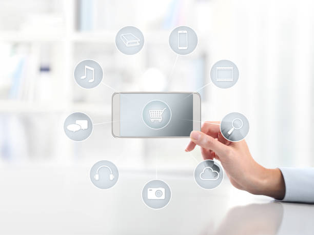 istock e-commerce concept, hand with smart phone and icons, web banner and copy space template 968306904