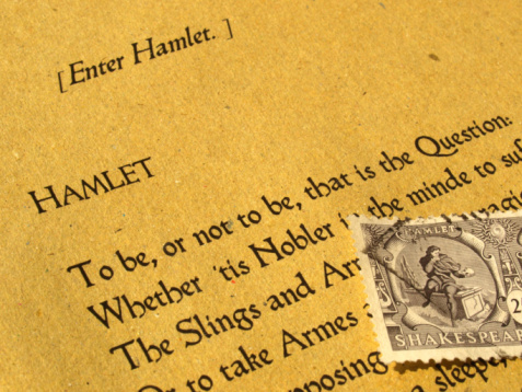 William Shakespeare's Hamlet (original Middle English text from the First Folio of 1623) with stamp - selective focus