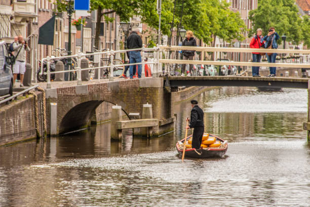A boat with cheeses in Alkmaar goes away. netherlands holland stock photo