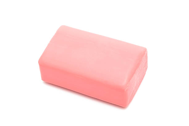 A rectangle piece of pink soap against a white background