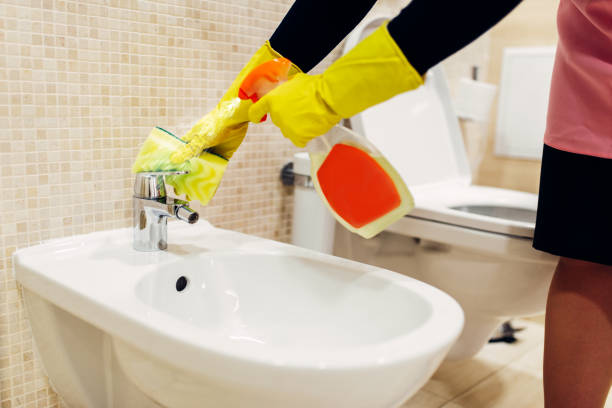 istock Maid cleans the bidet with a cleaning spray 968328952