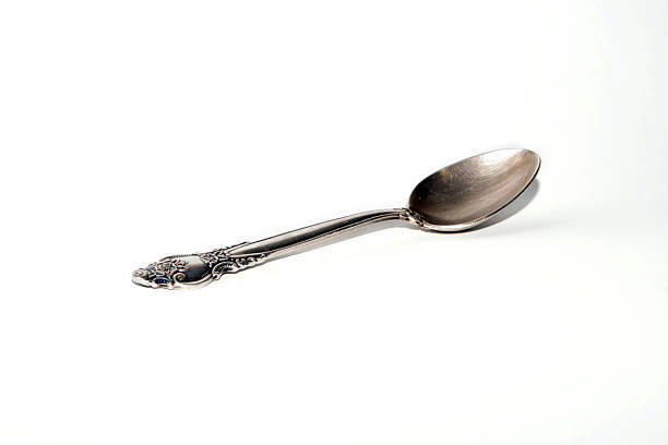 Old silver teaspoon stock photo