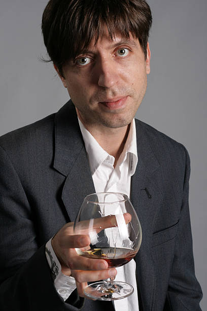 man with a cognac glass stock photo