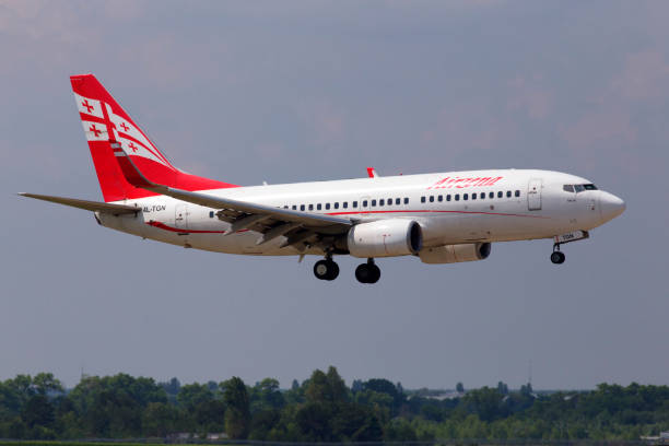 4L-TGN Airzena Georgian Airways Boeing 737-700 aircraft landing on the runway stock photo