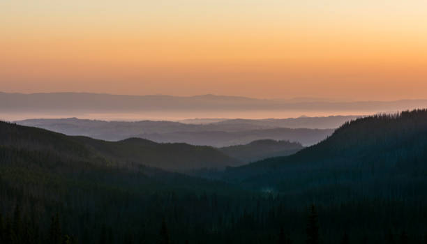 istock Morning fog over the valley at sunrise. 968347722