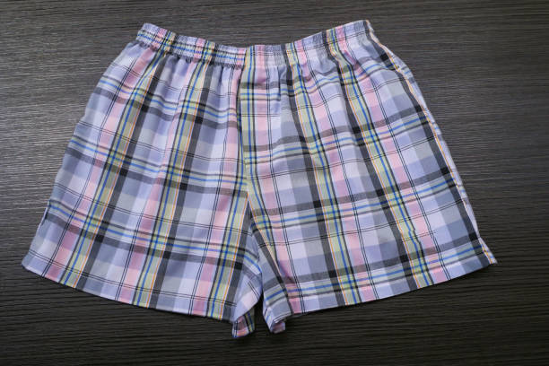 istock Men's boxer shorts on wood background 968356810