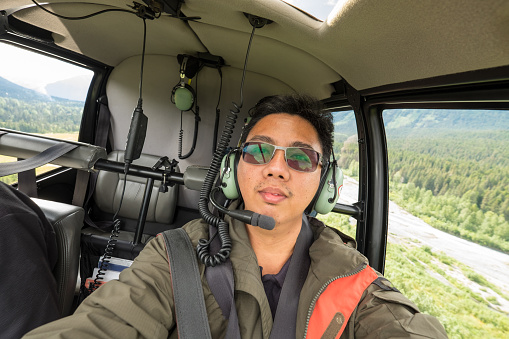helicopter ride to glacier snow mountain in alaska , usa