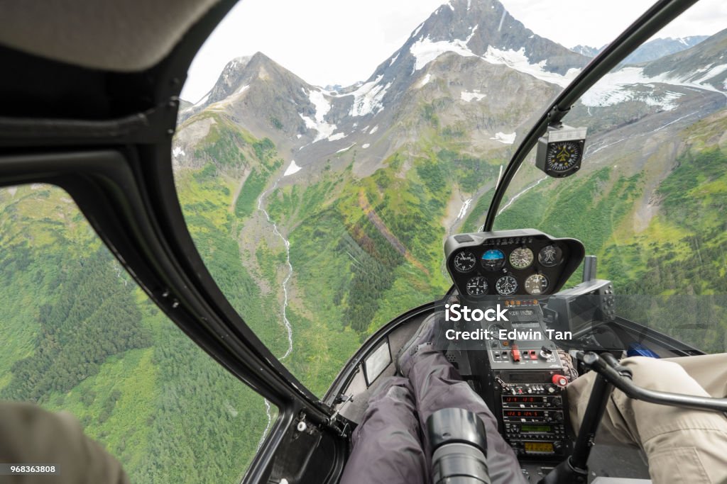 helicopter ride to glacier snow mountain in alaska , usa Helicopter Stock Photo