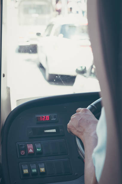 istock Hand of driver in a bus 968366844