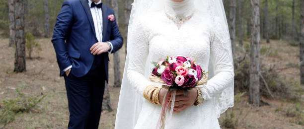 istock wedding bouquet in hands of bride 968369534