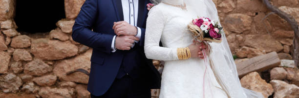 wedding bouquet in hands of bride