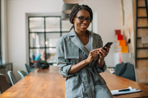 istock Portrait of smiling woman while networking 968372488