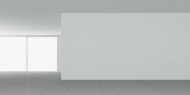 istock 3D rendering of white room space with interior lighting and sun light cast the window shadow on the wall and floor,Perspective of minimal design architecture. 968373516