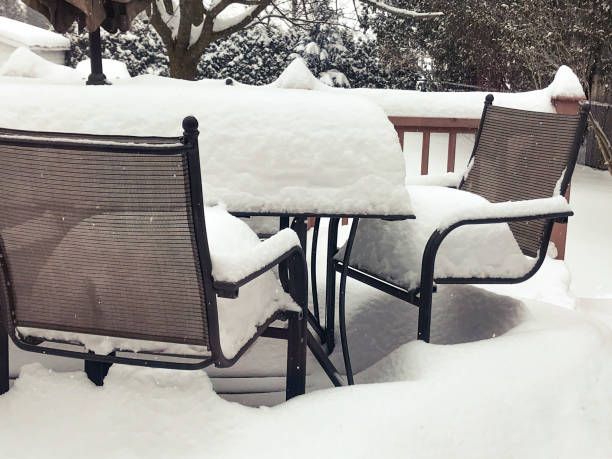 istock Patio Furniture Piled High With Snow 968377464