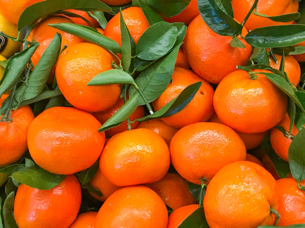 istock Mandarin Oranges Piled Up In The Store 968377514