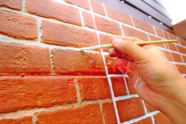 istock Paint the red brick wall paintbrush. 968387936