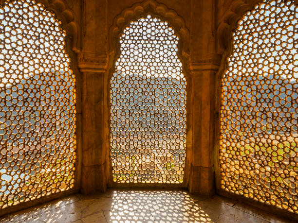 Perforated wall background Perforated wall background amber fort stock pictures, royalty-free photos & images