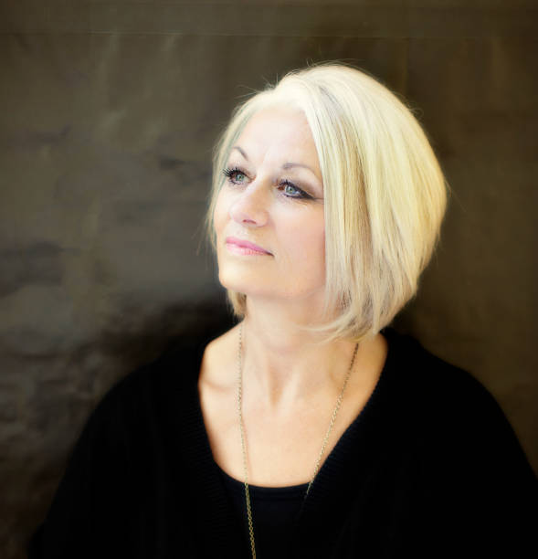istock 58 year old Pretty Lady Looks Heavenward 968398178