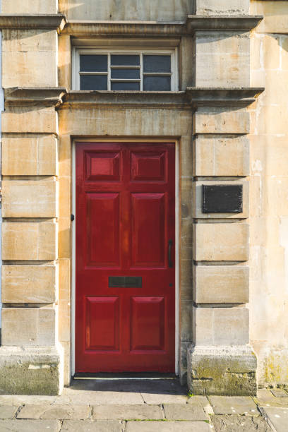 istock Red front door of residental building 968411972