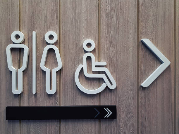 istock White Toilet Symbols on Wooden Plank Wall 968417122