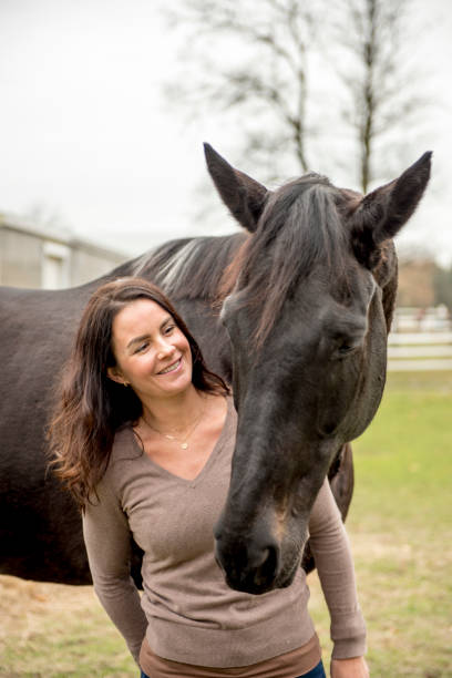 istock Young woman and her horse 968421778