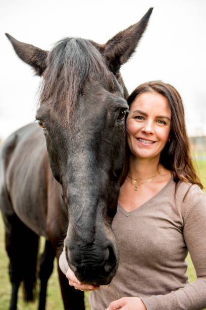 istock Young woman and her horse 968421798