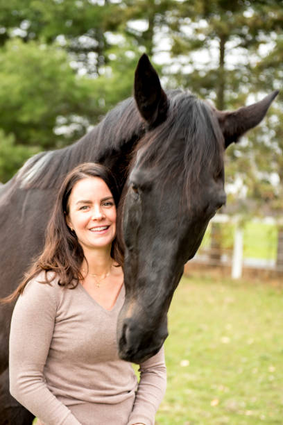istock Young woman and her horse 968421800