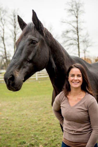 istock Young woman and her horse 968421806