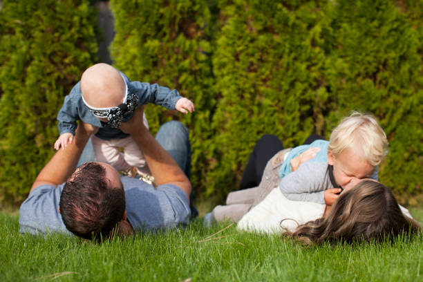 istock Family Plays in Green Grass 968422892