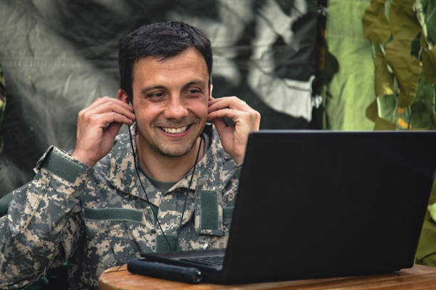 istock Soldier man video chatting with his family 968431778