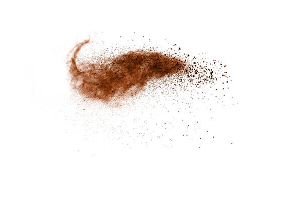 istock abstract brown dust explosion on white background. abstract brown  powder splattered on white background, Freeze motion of brown  powder splashing. 968431868