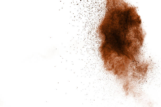 istock abstract brown dust explosion on white background. abstract brown  powder splattered on white background, Freeze motion of brown  powder splashing. 968431888