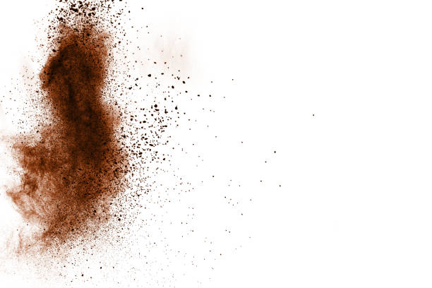 istock abstract brown dust explosion on white background. abstract brown  powder splattered on white background, Freeze motion of brown  powder splashing. 968431902