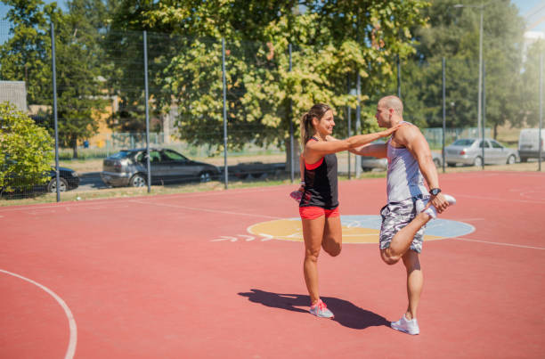 istock Happy young athletic couple exercising together. 968440190