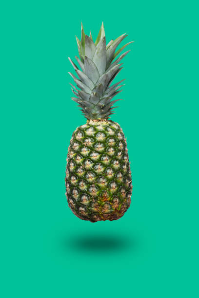 istock Fresh pineapple on the green colorfurful background 968443190