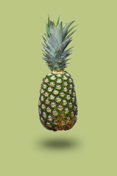 istock Fresh pineapple on the light brown colorfurful background 968443232