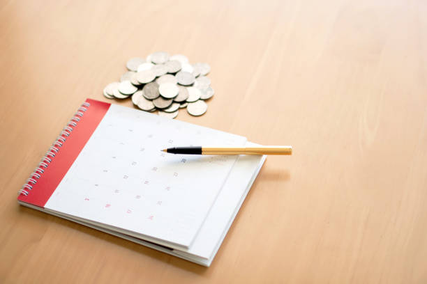 istock Coin,pen,and calendar 968445764