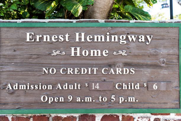 Ernest Hemingway house sign famous entrance with admission costs, no credit cards closeup in Florida island Key West, USA - May 1, 2018: Ernest Hemingway house sign famous entrance with admission costs, no credit cards closeup in Florida island hemingway house stock pictures, royalty-free photos & images
