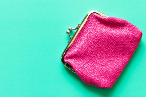 istock Pink wallet on turquoise background . Close up. Top view 968451218