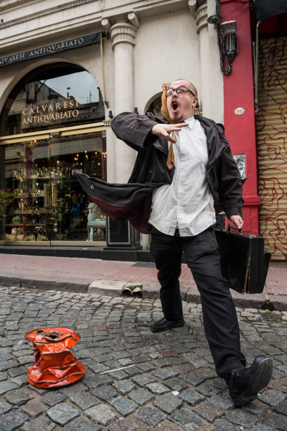Buenos Aires, Argentina - February 05, 2017: Street artist is seen in the neighborhood San Telmo in Buenos Aires. San Telmo is a well-preserved area of the Argentine metropolis and is characterized by its Cafes, tango, antique shops line the cobblestone streets, which are often filled with artists and dancers.