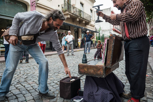 Buenos Aires, Argentina - February 05, 2017: Street performer presents with puppet on the streets of the tourist district of San Telmo in the Argentine capital, Buenos Aires.