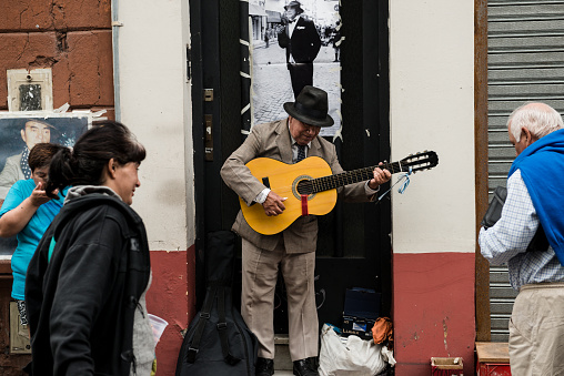 Buenos Aires, Argentina - February 05, 2017: Street musician is seen playing tango in the streets of the touristy district of San Telmo in the Argentine capital, Buenos Aires.