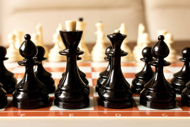 istock Black and white chess on the chessboard. Selective focus 968458490