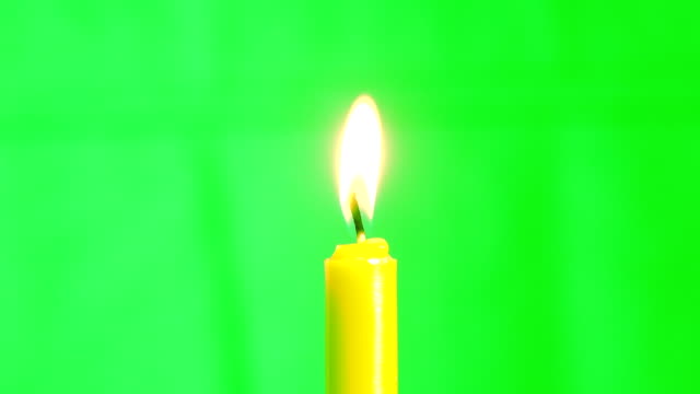 Candle burning concept, Slow motion fire flame burning candle on green screen