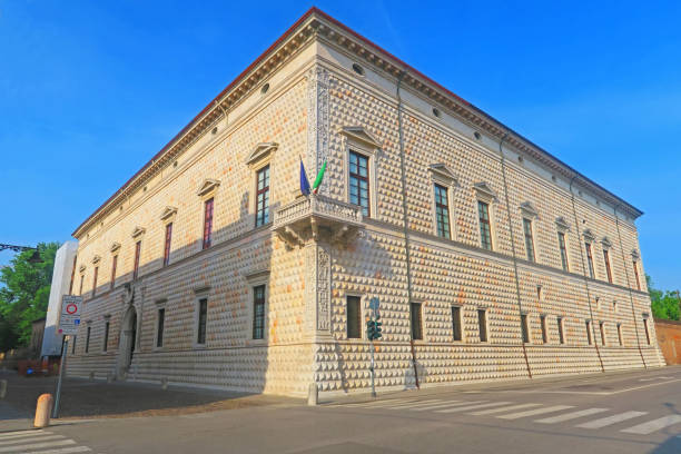 Ferrara,Italy,3 june 2018.Palazzo dei Diamanti is a Renaissance palace in Ferrara, in the Emilia Romagna region, Italy. It was built between 1493 and 1503. Its main feature is the exterior ashlar-shaped diamond spikes, which give the building its name. The approximately 8,500 blocks of white-veined pink marble create valuable perspective effects thanks to the different shape of the tips.
