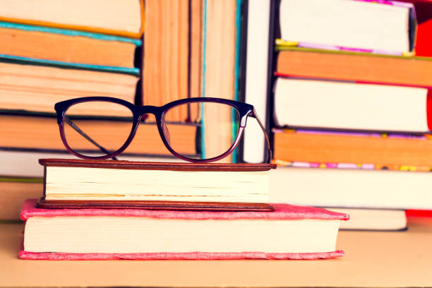 istock Top view of bright colorful hardback books in a circle. 968489624