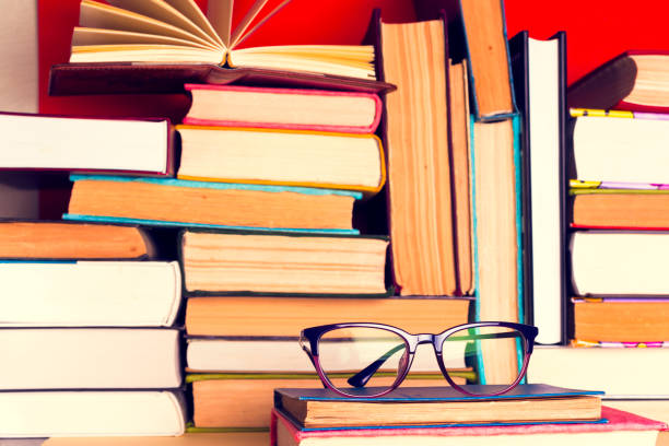 istock Top view of bright colorful hardback books in a circle. 968489672