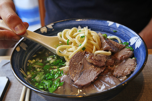 A hearty dish of Lanzhou lamian, Chinese ramen with broth, spices and beef